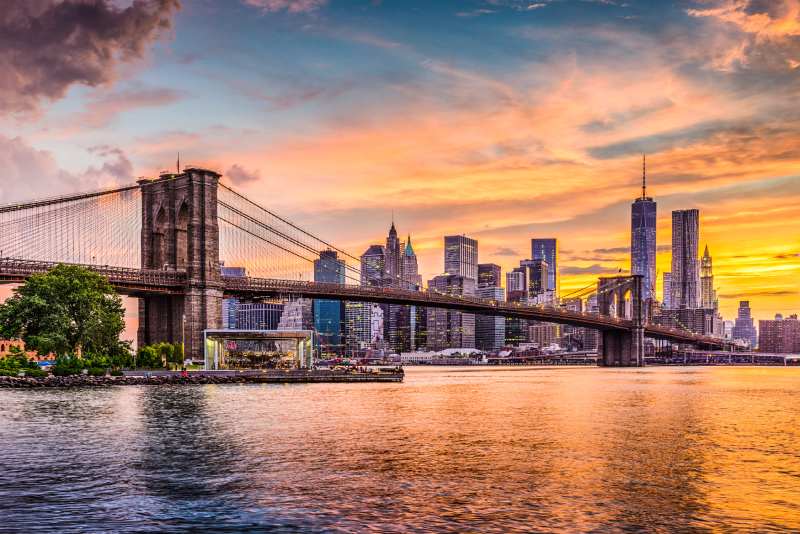 A view of the brooklyn bridge and lower manhattan.